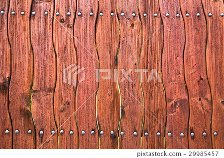 Wooden curved fence of brown color 29985457
