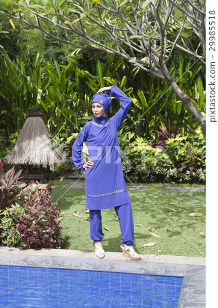 attractive woman in a Muslim swimwear burkini stan 29985518