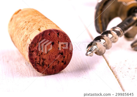 Wine cork and corkscrew close-up. 29985645