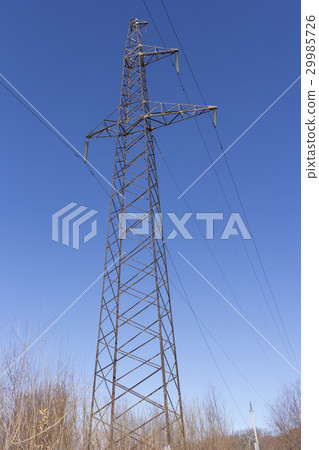 Concrete electric pole with wires against the sky 29985726