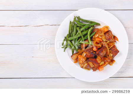 tasty meat stew on white plate 29986259