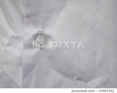 semi transparent plastic button on white cotton sh semi transparent plastic button on white cotton sh 29987842