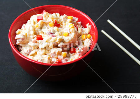 russian salad in a red bowl with chopsticks russian salad in a red bowl with chopsticks 29988773