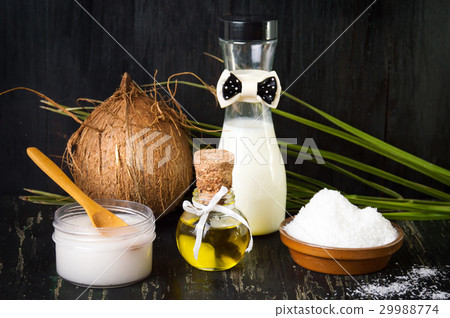 Various coconut products on black background 29988774