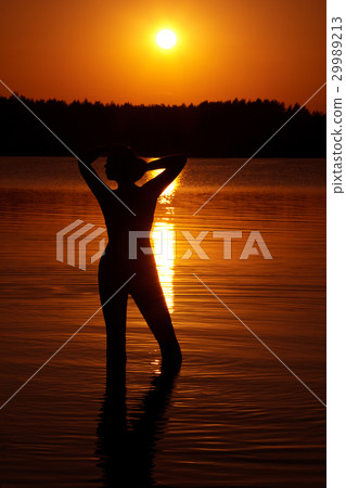 Female silhouette at sunset Female silhouette at sunset 29989213