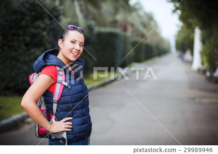 girl with a backpack in the alley 29989946