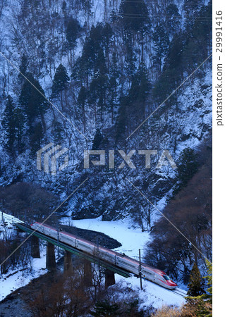 Akita Shinkansen going through the valley 29991416