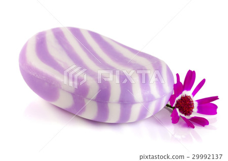 White purple striped soap with a flower isolated 29992137
