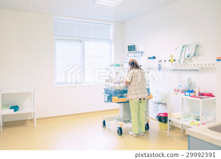 Newborn baby sleeping in an incubator in hospital Newborn baby sleeping in an incubator in hospital 29992391
