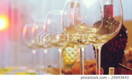 Glass glasses on a table in a restaurant, banquet Glass glasses on a table in a restaurant, banquet 29993643