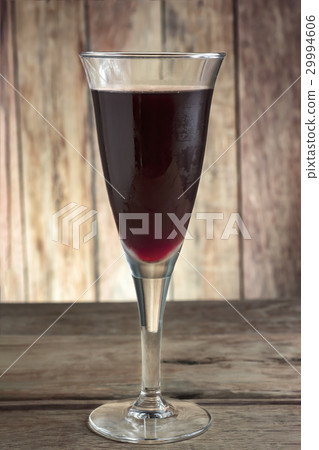 Ice Cocktail glass on a wooden table. Ice Cocktail glass on a wooden table. 29994606