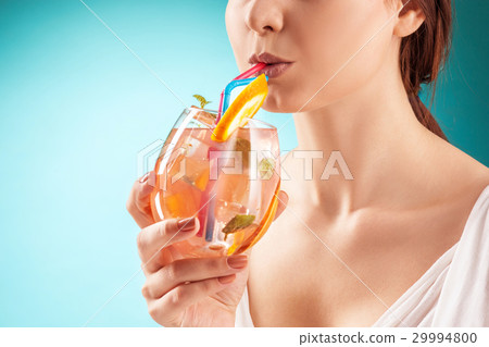 The pretty woman drinking cocktail. Emotion 29994800
