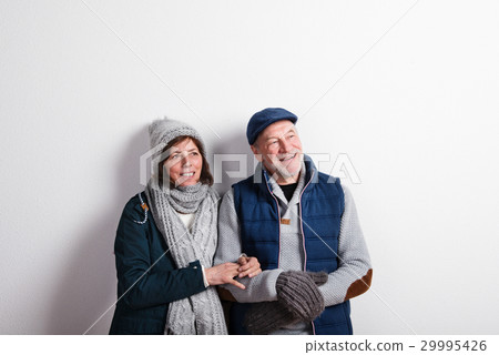 Beautiful senior couple in love in winter clothes Beautiful senior couple in love in winter clothes 29995426