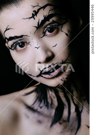 beautiful woman with creative make-up halloween 29995446