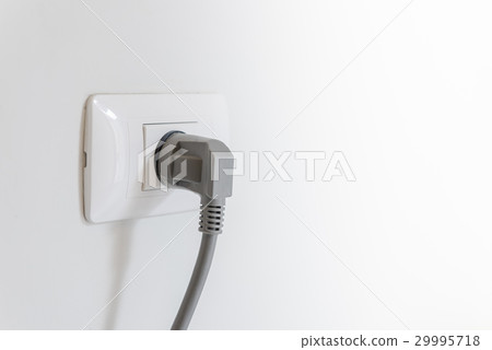 socket plug with electric plug line on white wall 29995718