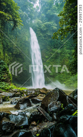 Amazing Nungnung waterfall, Huge Rocks in front Amazing Nungnung waterfall, Huge Rocks in front 29997393