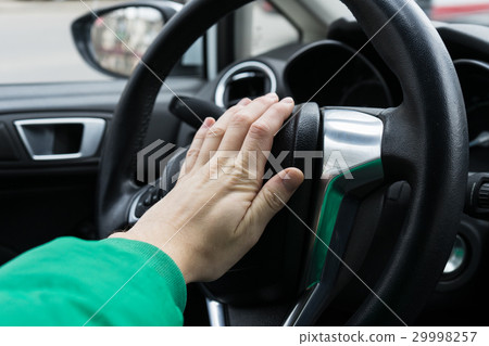 Nervous man driver pushing car horn Nervous man driver pushing car horn 29998257