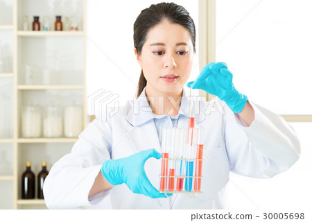 Asian female scientist researcher observing Asian female scientist researcher observing 30005698