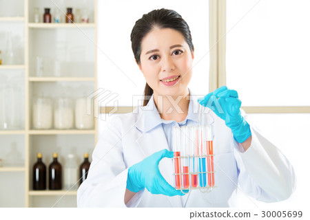Asian female scientist researcher observing Asian female scientist researcher observing 30005699