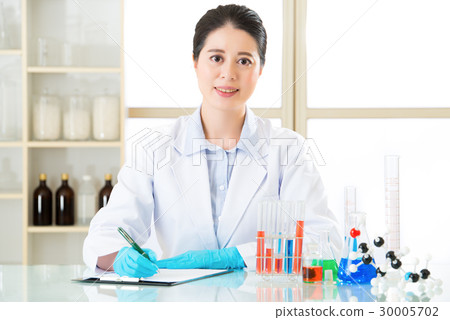 Asian female scientist recording research data 30005702