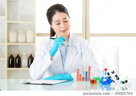 Asian female scientist happy to recording 30005703