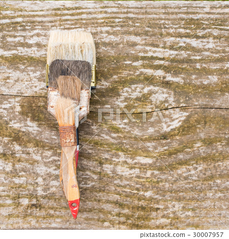 Used brushes on wooden background 30007957