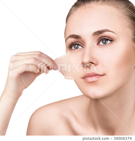 Woman remove her old dry skin from face. 30008374
