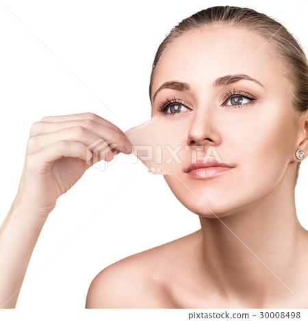 Woman remove her old dry skin from face. Woman remove her old dry skin from face. 30008498