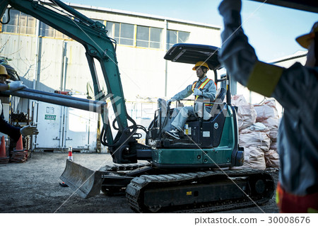 Male driving construction site shovel car 30008676