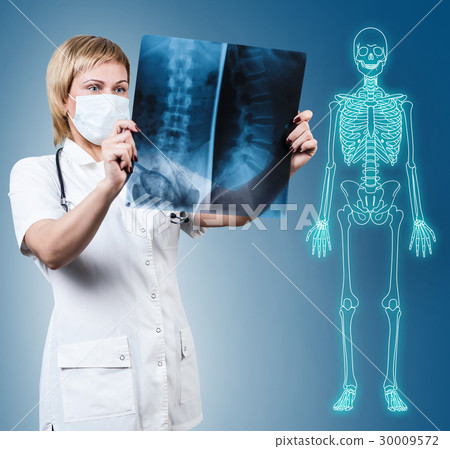 Female doctor looking at an x-ray. 30009572