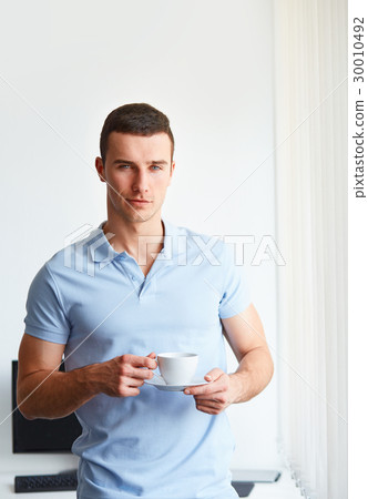 Handsome man drinking coffee 30010492