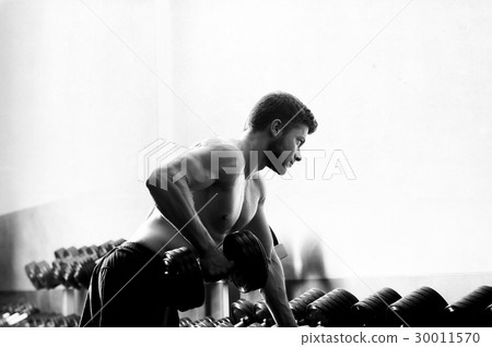Monochrome shot of a ripped shirtless man Monochrome shot of a ripped shirtless man 30011570