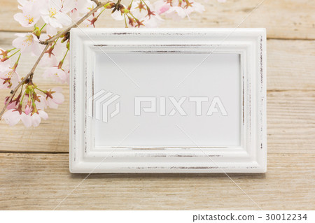 White photo frame and cherry blossoms 30012234