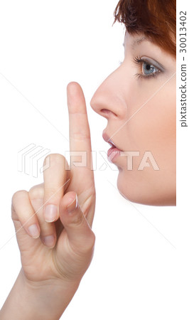The girl shows a sign to be quieter 30013402