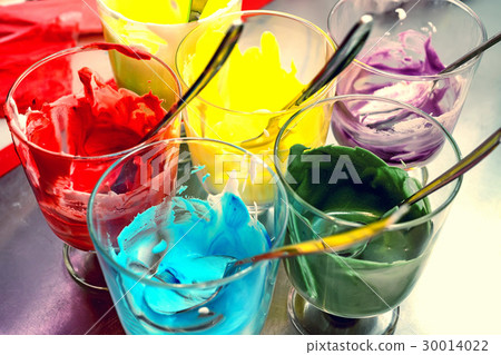 Glasses of various food coloring 30014022