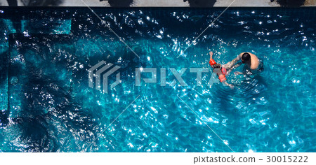 Happy dad and young daughter swimming together. 30015222