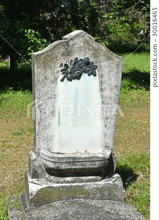 Old tombstone in the public cemetery 30016465