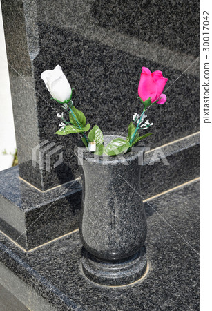 Vase with flowers on the tombstone Vase with flowers on the tombstone 30017042