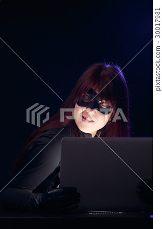 Woman in mask with laptop Woman in mask with laptop 30017981