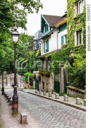 Charming old street of Montmartre hill. Paris 30018051