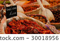 Delicious dry tomatoes at the market. 30018956