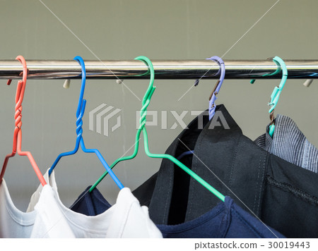 Colorful plastic hanger with the shirt. Colorful plastic hanger with the shirt. 30019443
