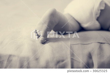 A little baby is resting at home. A little baby is resting at home. 30025325