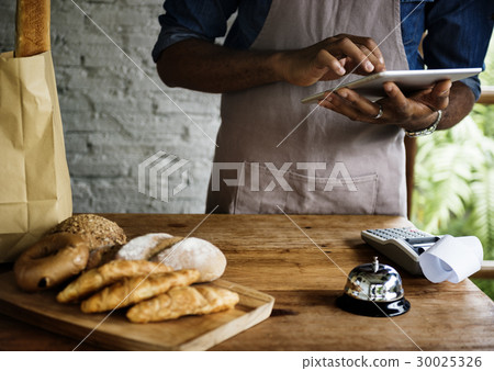 Men Checking Stock of Pastry in Bakery Shop Men Checking Stock of Pastry in Bakery Shop 30025326