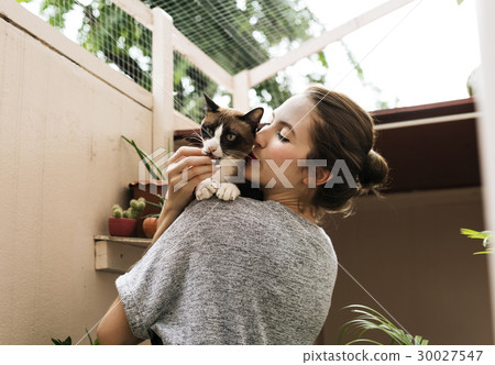 Woman Playing With Cat Holiday 30027547