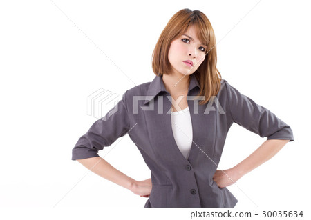 angry, upset business woman with arms akimbo 30035634