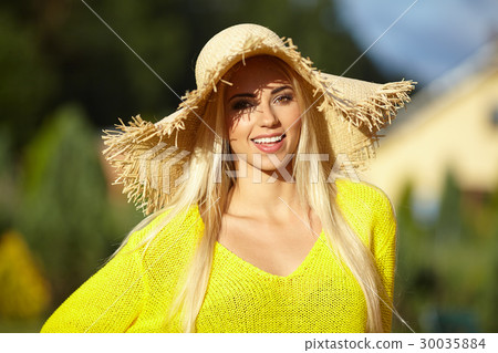 Close-up portrait of smiling female by the sea. Happy woman stan 30035884