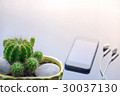 Smartphone and cactus  on working table. 30037130