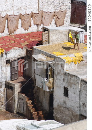 Tanner drying hides on the roof top of the Tannery 30040399