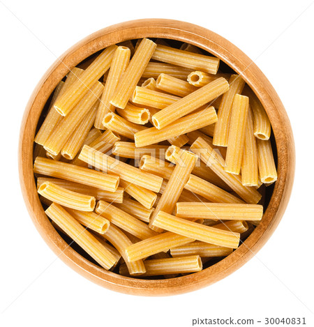 Chickpeas sedanini pasta in wooden bowl over white Chickpeas sedanini pasta in wooden bowl over white 30040831